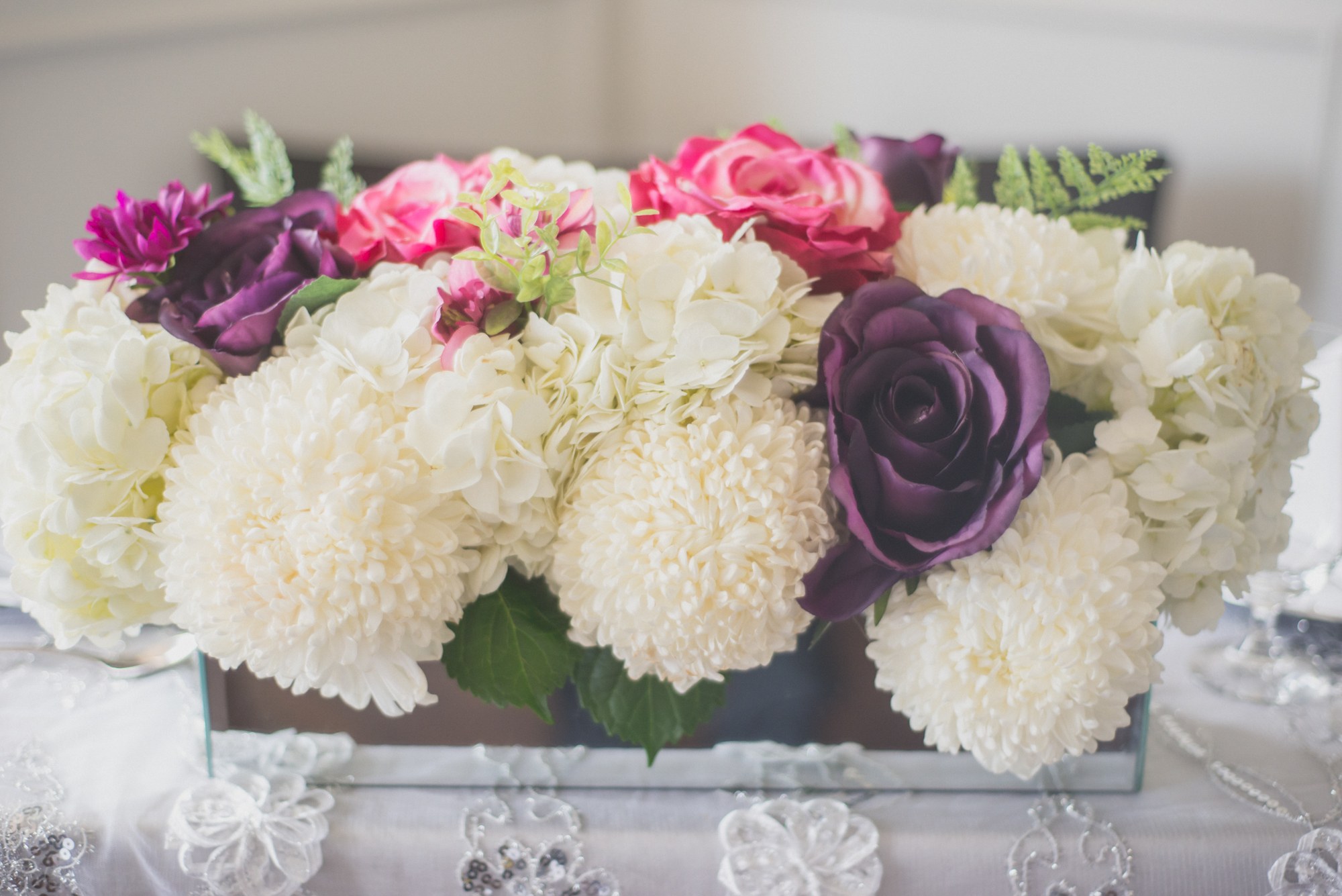 White and purple flowers arranged for the celebration